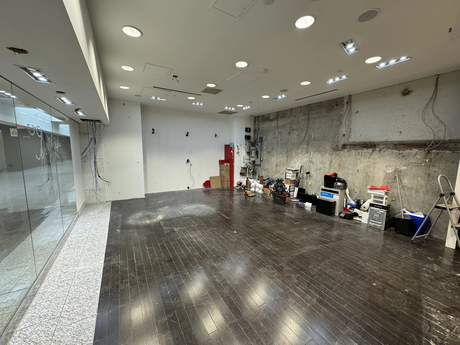 Retail interior with exposed wall surfaces and tools during improvement work